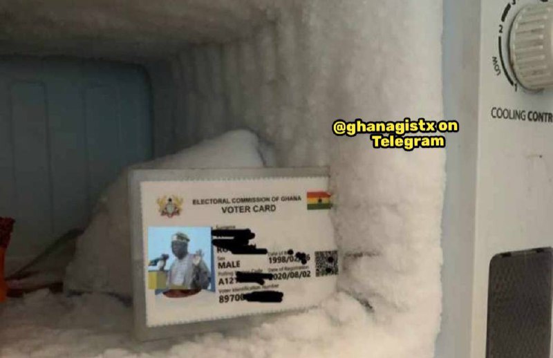 a man is standing in the snow next to a television